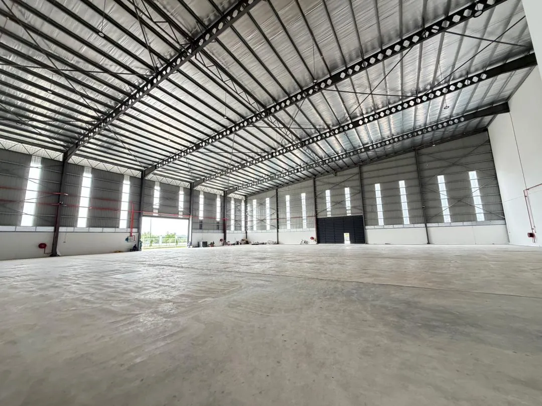 Empty clear-span factory floor with daylight panels