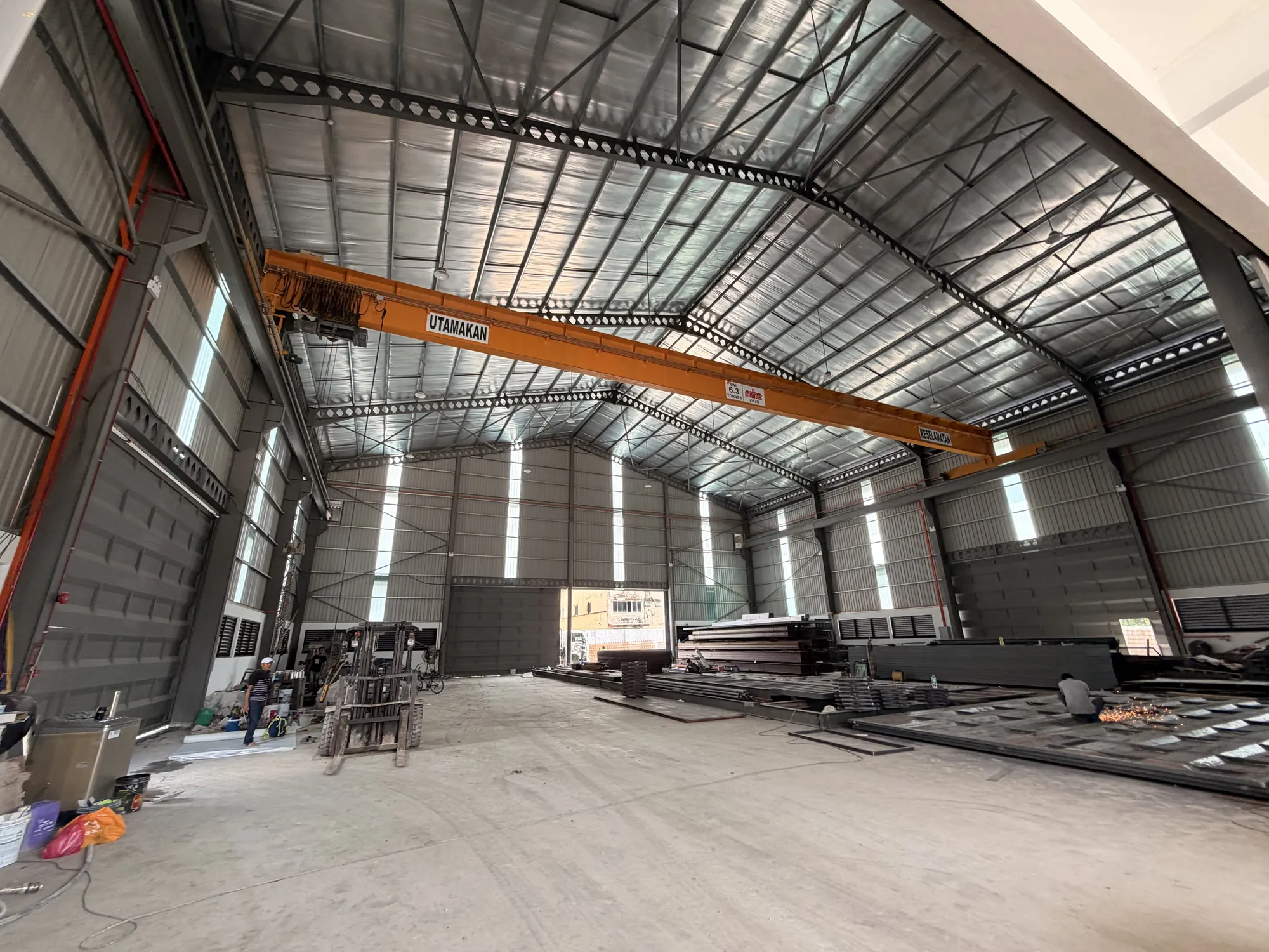 Factory interior with an overhead travelling crane spanning the bay