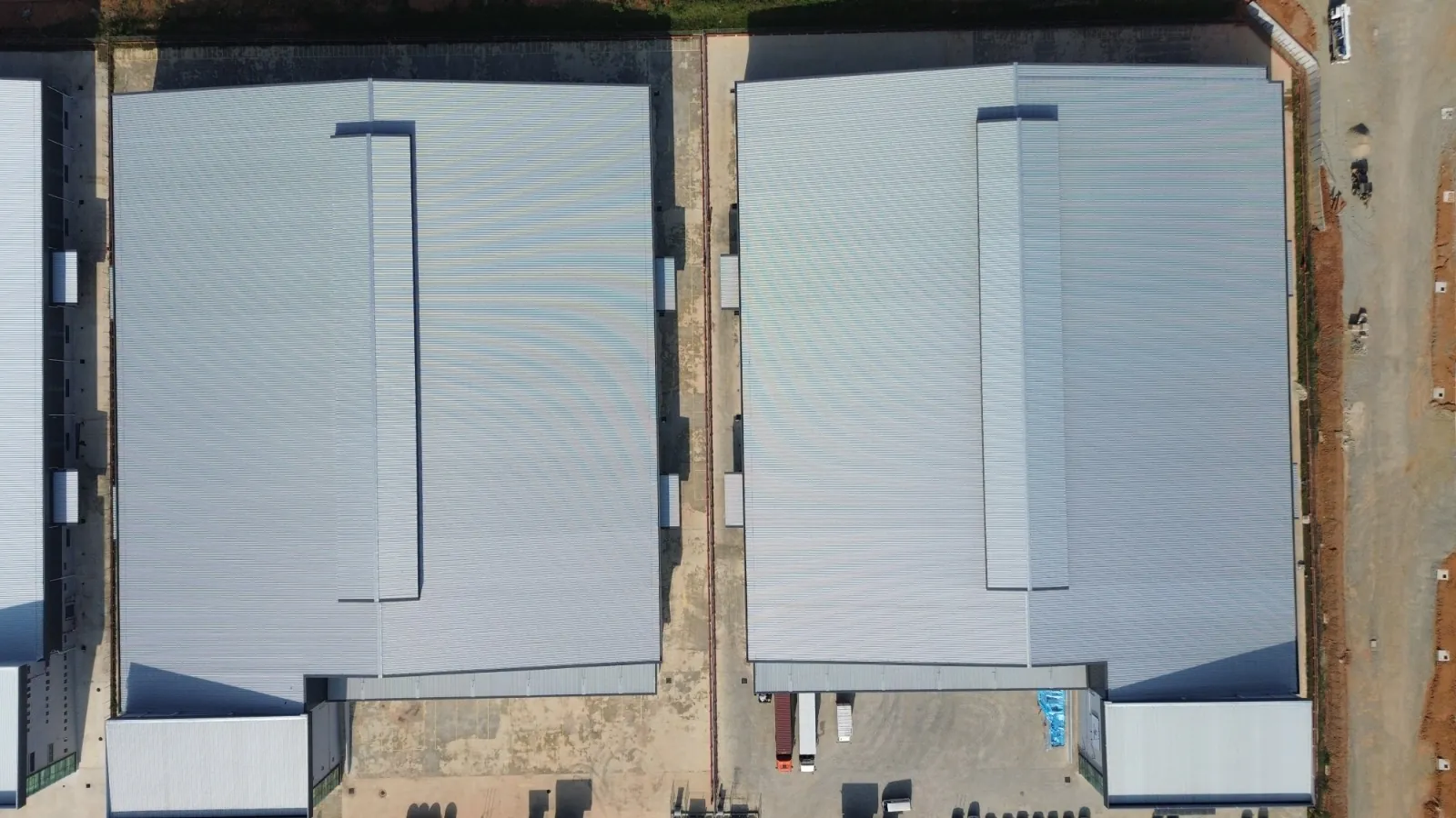 Top-down aerial of two new detached factories
